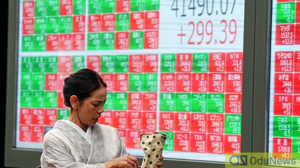 Asian Markets Mixed as China Cuts Interest Rates; Gold Hits Record High Amid Geopolitical Tensions  