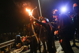 [VIDEO] Protesters Fight Off Police With Fire, Arrows  