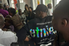Passengers blocking the boarding gate of Nnamdi Azikiwe International Airport in Abuja